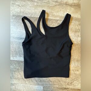 Becca black size XS athletic top, asymmetric strap detail